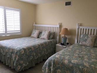 Guest bedroom with queen size bed and a twin bed. Bedroom can sleep 3
