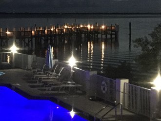 Condo pool and fishing pier at night