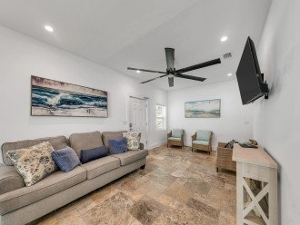 Beachy Fresh Vibes in Your Open Living Room With Large Couch and Adjacent Seats