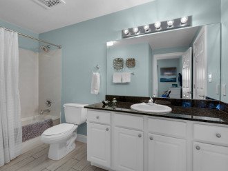 Guest bath w/access from 2nd bedroom or hall has full tub & shower combo