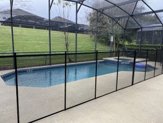 Screened in pool with child safety fence