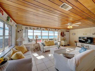 Living room with beach just outside.
