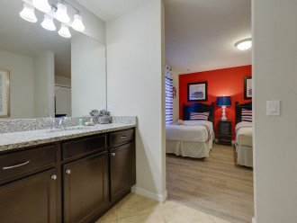 Two twin bedrooms share a bathroom