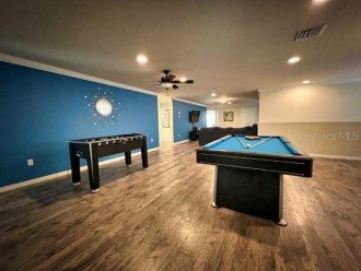 Second floor living area with pool table as well as Foosball