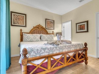 Master bedroom with king bed and inside bathroom