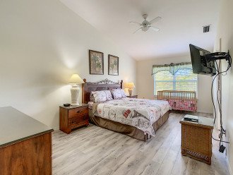 Master bedroom with king bed and inside bathroom