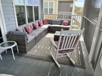 Large Outdoor Sectional plus rocking chairs on screen proch