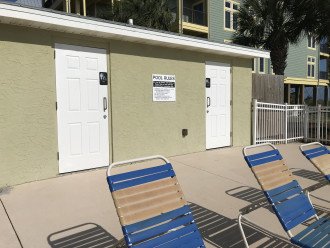 Pool restrooms adjacent to boardwalk to the beach