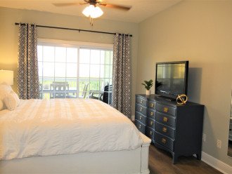 Master bedroom with Kind Bed, private bathroom and direct balcony access