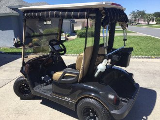 Newer model Yahama gas powered golf cart included.