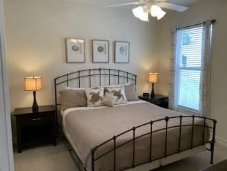 2nd bedroom with king bed, dual nightstands and weather station/clock