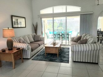 Living Room with views of Pool and Lanai Area