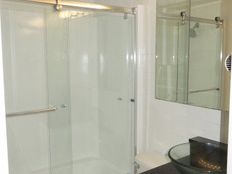Newly remodeled guest bathroom with vessel sink and tub / shower combo