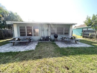 Fenced Back Yard with deck, grill and picnic table