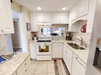 Fully equipped kitchen with new countertops and refrigerator freezer