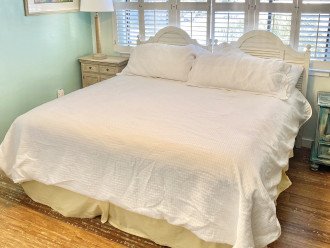 Guest bedroom on upper floor includes a comfortable king bed plus bunk beds.