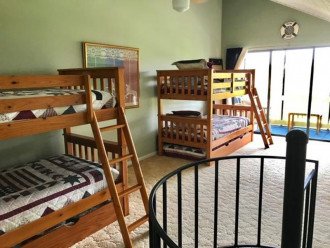 Two sets of bunk beds with pull out trundle beds beneath each