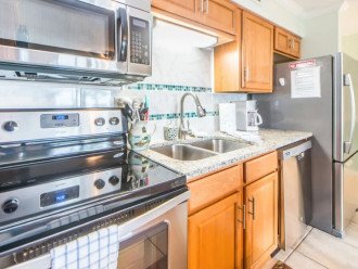 Prepare meals in the full kitchen with stainless steel appliances.
