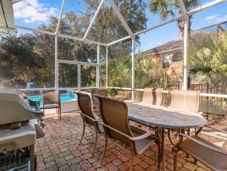 Plenty of room for grilling & dining in the screened-in lanai.