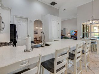 The kitchen and dining room have amply seating for your group.