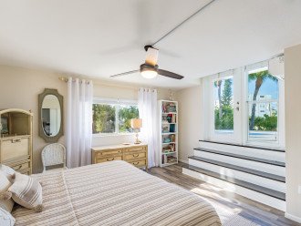 Front upstairs bedroom - king bed - view of beach
