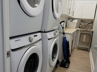 Laundry Room with 2 washers and 2 dryers