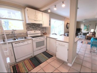 Full size kitchen and appliances with counter seating