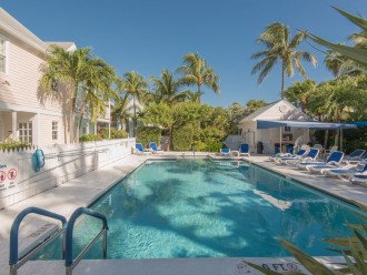 Relax by the pool within a one-minute walk from Shabby Chicken condo.