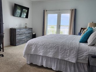 Left hand upstairs corner bedroom with a full water view and balcony