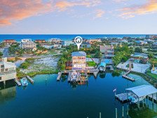 Sun Kissed | Waterfront Mansion | Boat Slips | Pool | Game Room | Beach Views