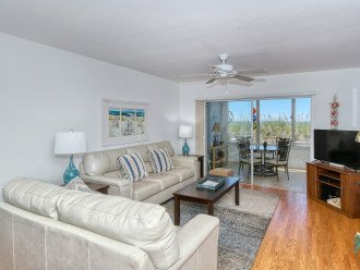 Spacious living room with HDTV, view to Lanai, beach and Gulf of Mexico - walk out to beach