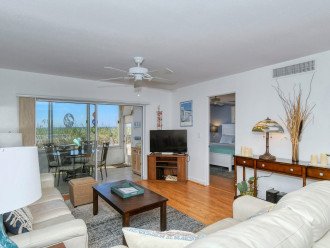 Spacious living room with HDTV, view to Lanai, beach and Gulf of Mexico - walk out to beach