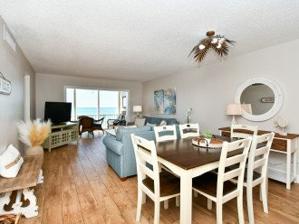 Spacious living room with HDTV, view to Lanai, beach and Gulf of Mexico