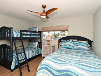 2nd Bedroom with full-size plus two twin-size bunk beds, HDTV, large window overlooking bay and boat docks