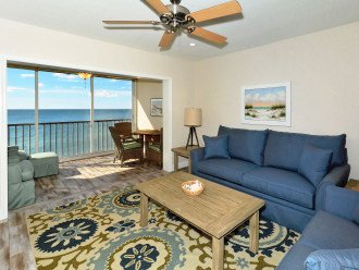 Spacious living room with view out to Lanai, the beach and azure waters of the Gulf of Mexico...large HDTV, stereo, and more...