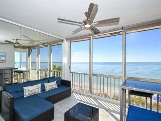 Enclosed, air conditioned lanai has an amazing view of the Gulf and the beach below.