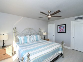 Master bedroom with bay window overlooking the Gulf and beach below. King-size bed with large HDTV. En Suite bathroom. Walk-in closet.