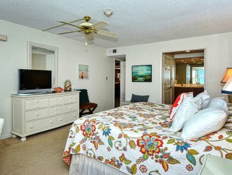Master bedroom with large windows, HDTV, walk-in closet, large en suite bathroom