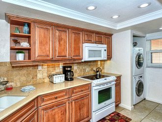 Modern updated kitchen granite counter tops, tile backsplash, and new appliances