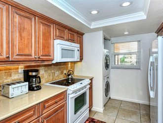 Modern updated kitchen granite counter tops, tile backsplash, and new appliances