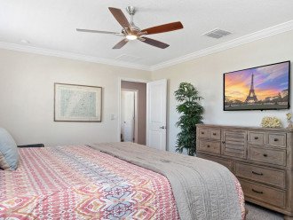 Sneak away to the upstairs king bedroom 48 inch TV, ceiling fan and private, attached bath.