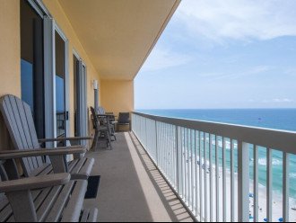 Step out onto the balcony from 3 double glass sliding doors. View to the east.
