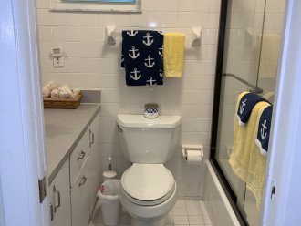 Bathroom with tub and enclosed shower on second floor