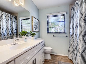 2nd Bathroom with quartz white counters and shower/tub combo