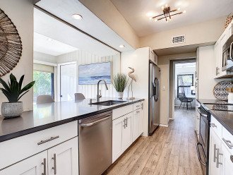Upgraded kitchen with stainless steel appliances and quartz countertops
