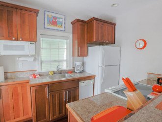 Fully equipped kitchen with door to private front balcony