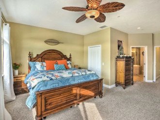 Luxurious master bedroom with attached master bath and smart TV