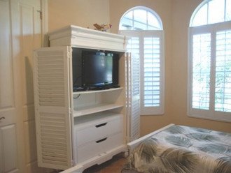 3rd bedroom with dresser and full closet