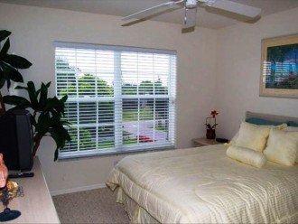 Third Level Bedroom with Queen size bed that overlooks Pool.