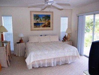 Third Level Master with King size bed leading to open balcony, beach view.